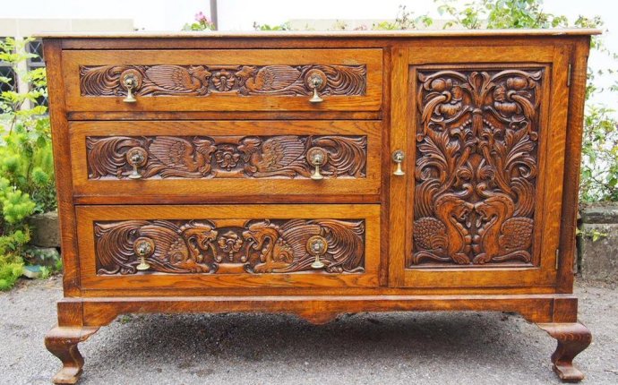 A Stunning 1930 s Handmade Bespoke Heavily Carved Sideboard with
