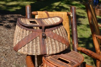 Antique creels and furniture for sale at a popular Upstate New York attraction, the Adirondack Antique Show.