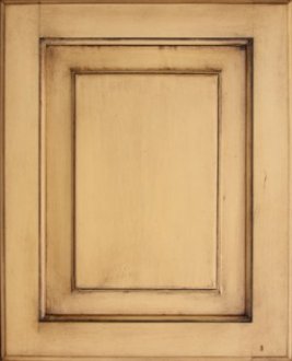Cabinet door antiqued using wood stain over paint.