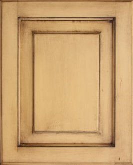 Cabinet door antiqued using wood stain over paint.